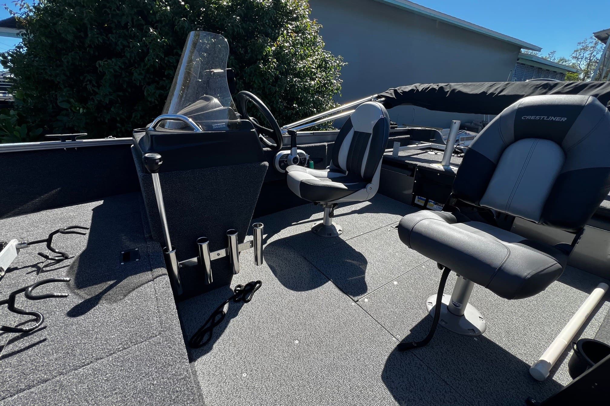 2023 Crestliner 1600 Vision boat interior with steering console and seating.