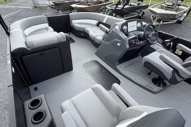 Interior of a 2027 Evotti 523CS boat with modern seating and steering console.