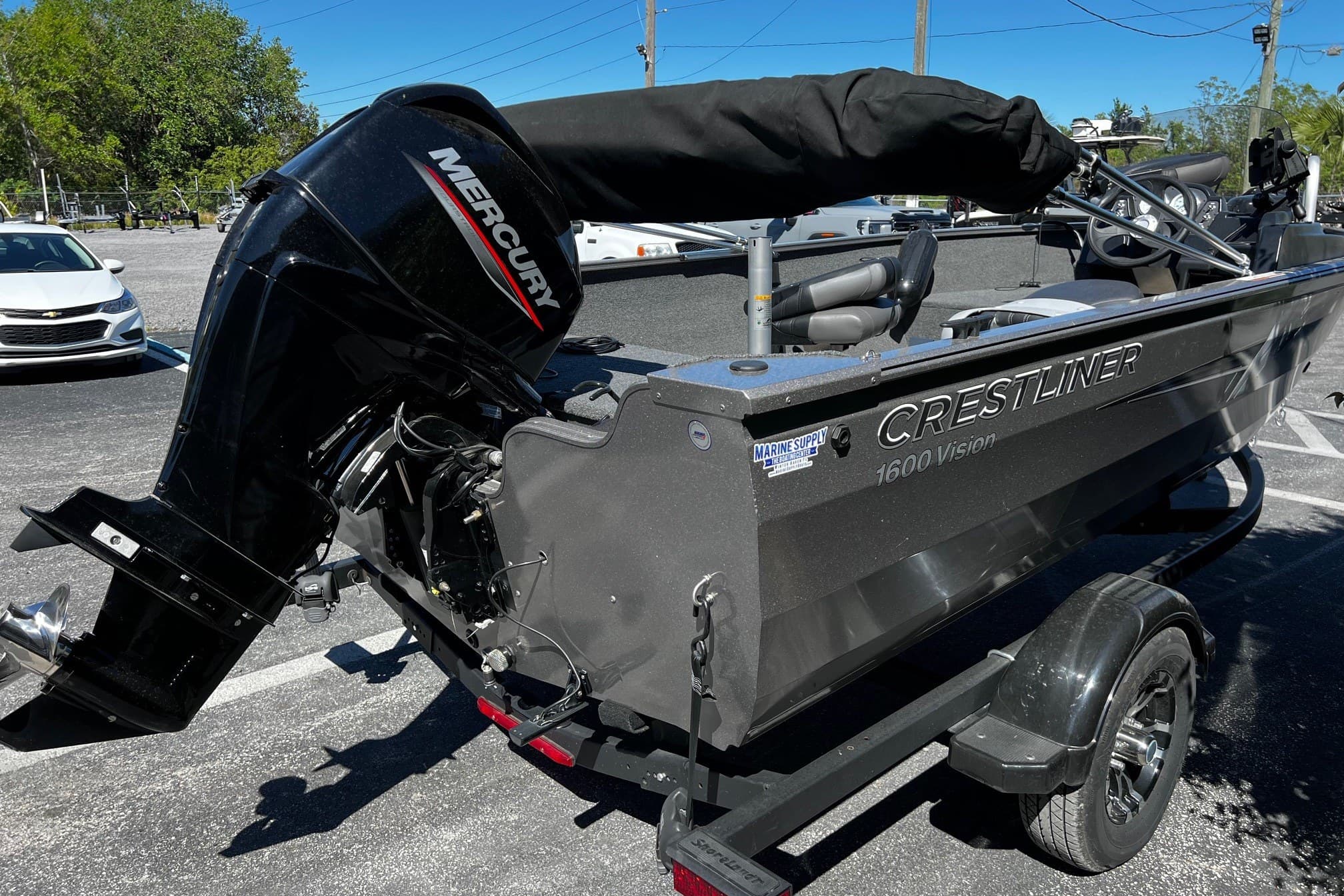 2023 Crestliner 1600 Vision boat with Mercury outboard motor on trailer.