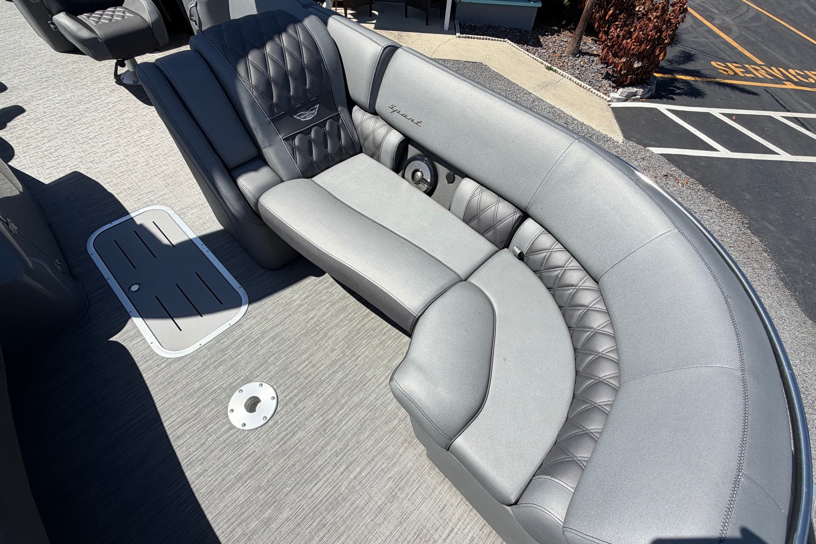 Luxurious seating on a 2022 Bennington 25 QX pontoon boat, featuring quilted upholstery.