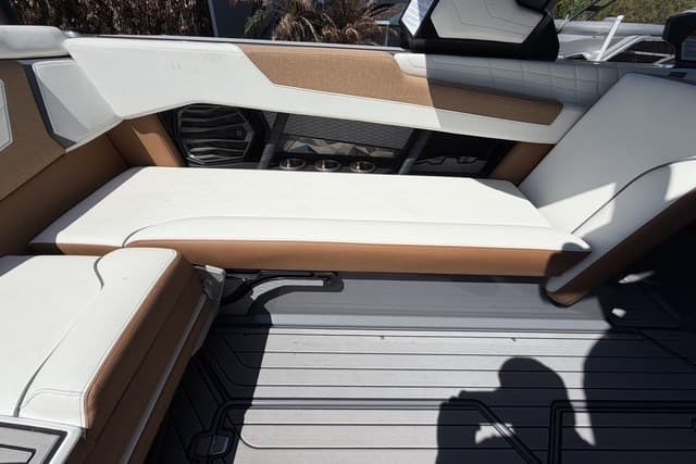 2022 Nautique Super Air Nautique G25 interior seating with white and tan upholstery.