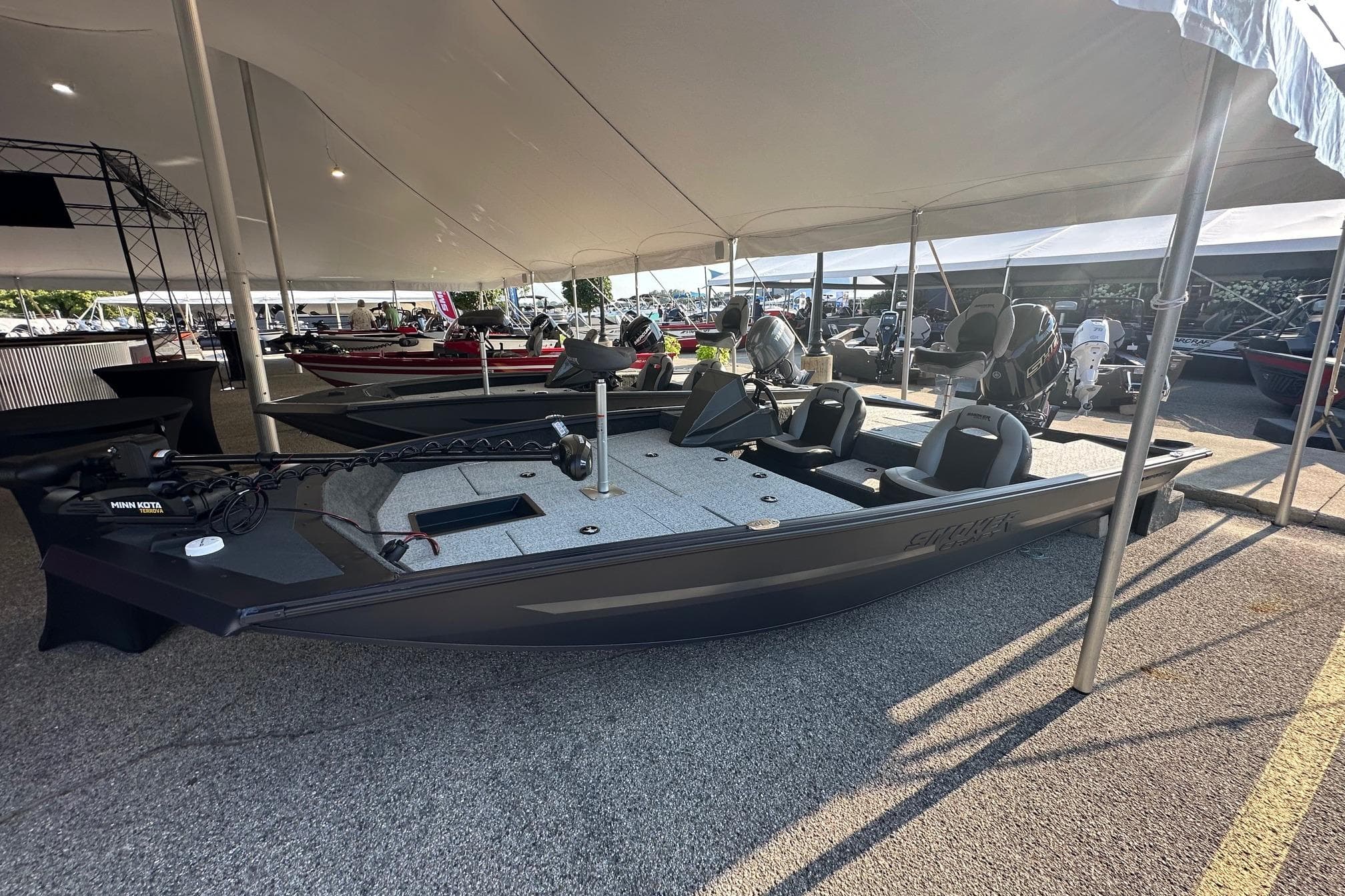 2026 Smoker Craft VIPER 175 boat displayed under a tent at a boat show.