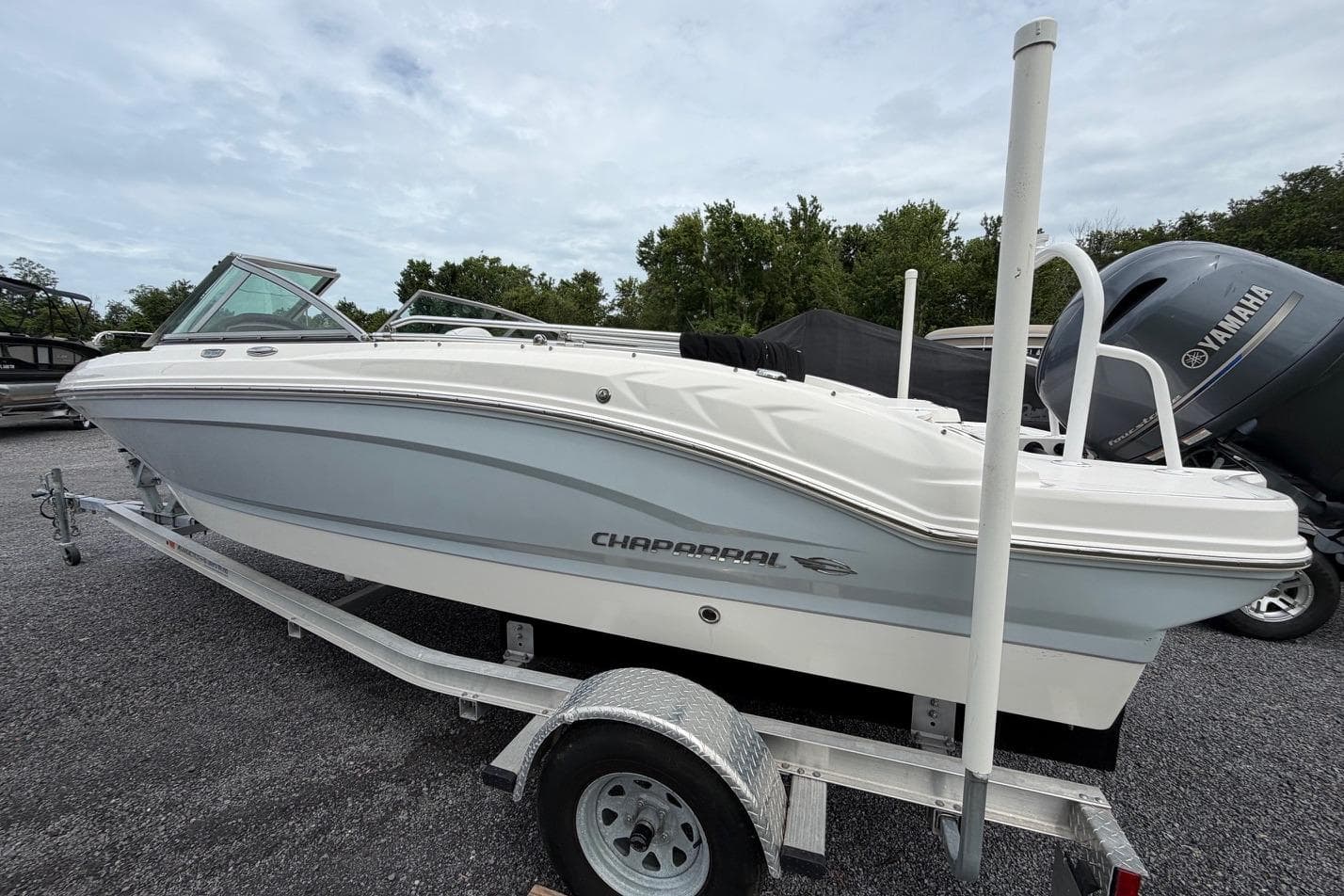 2020 Chaparral 196 SSi boat on trailer, parked outdoors with Yamaha engine visible.