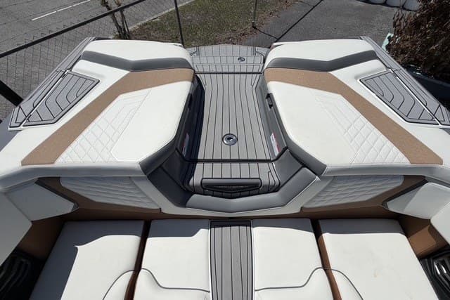 2022 Nautique Super Air Nautique G25 boat interior with cushioned seating and sleek design.