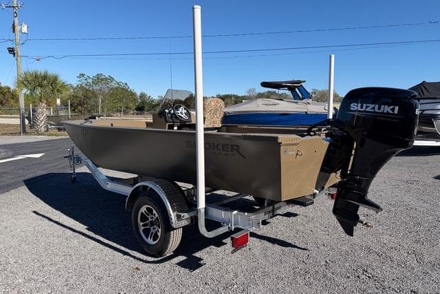 2026 Smoker Craft Pro Sportsman 1660 boat with Suzuki outboard motor on trailer.