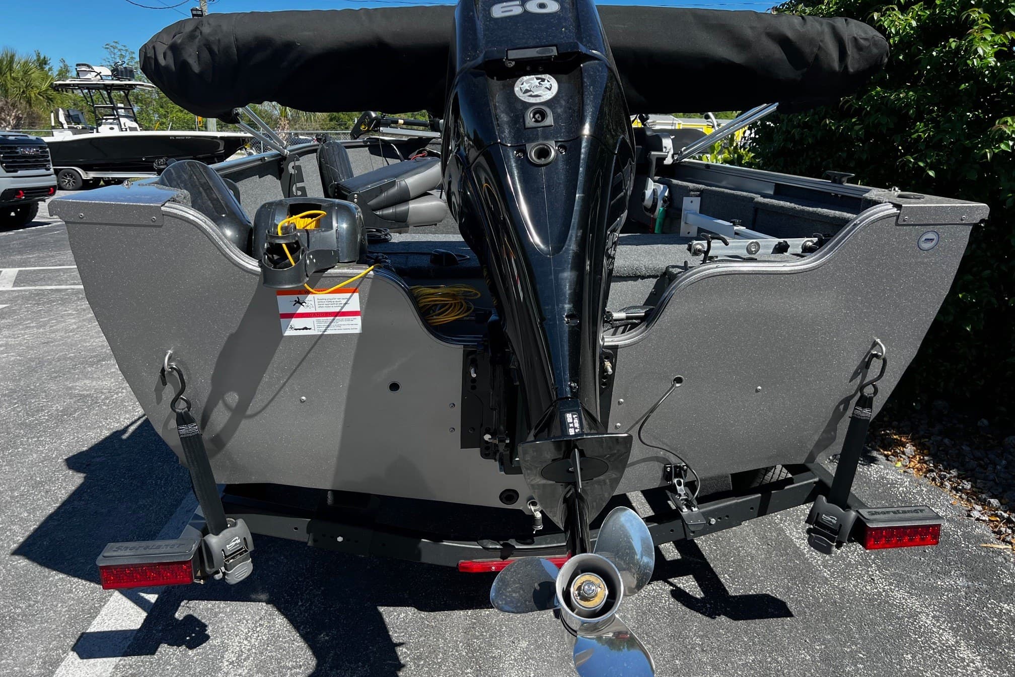 2023 Crestliner 1600 Vision boat with outboard motor, parked on a trailer.
