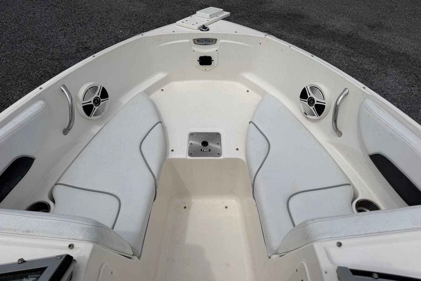 2020 Chaparral 196 SSi boat interior with white seating and speakers.