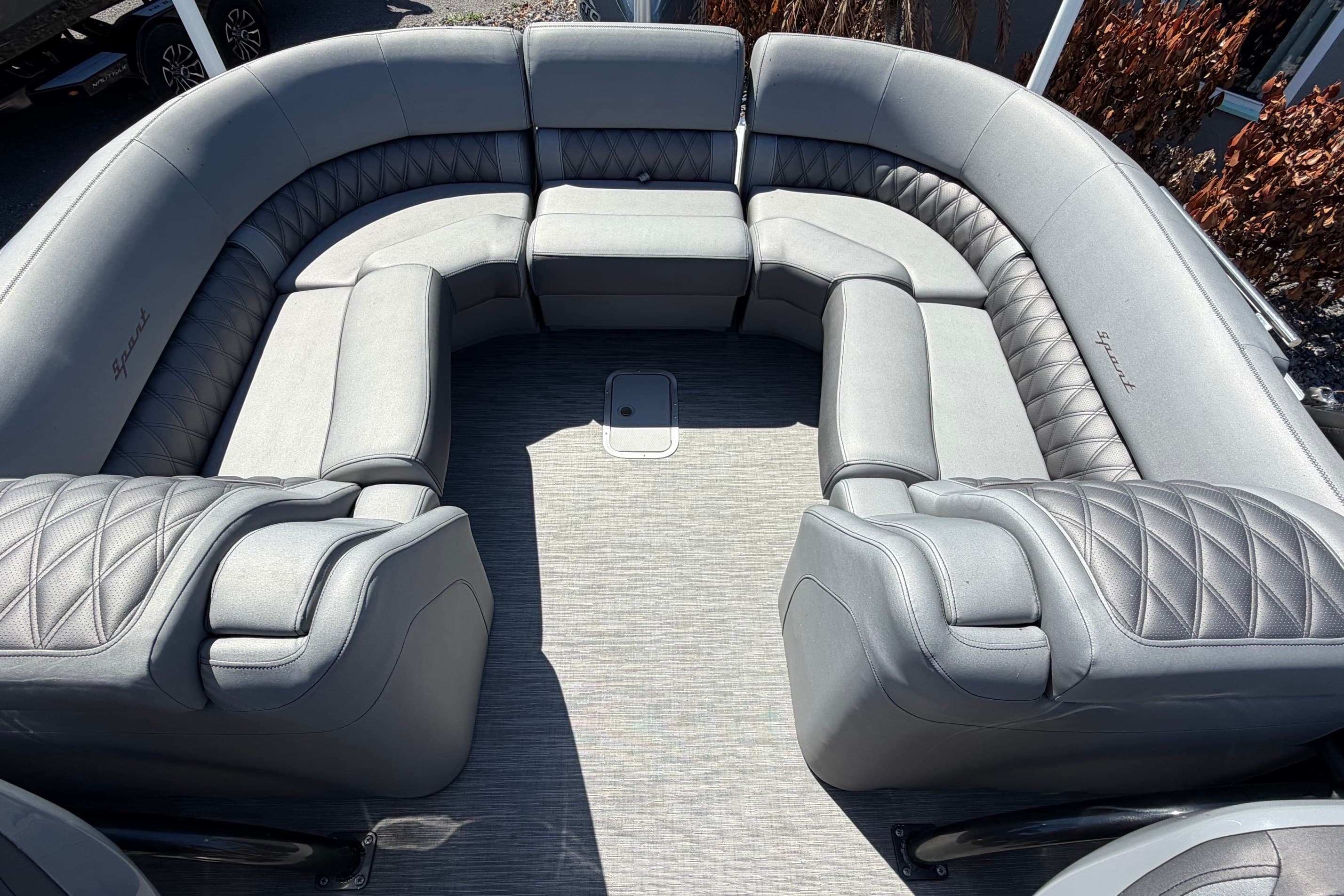 Luxurious seating on 2022 Bennington 25 QX pontoon boat with quilted upholstery.