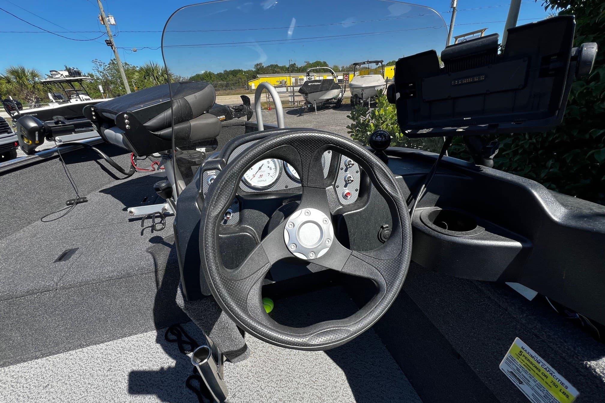 2023 Crestliner 1600 Vision boat dashboard with steering wheel and controls.