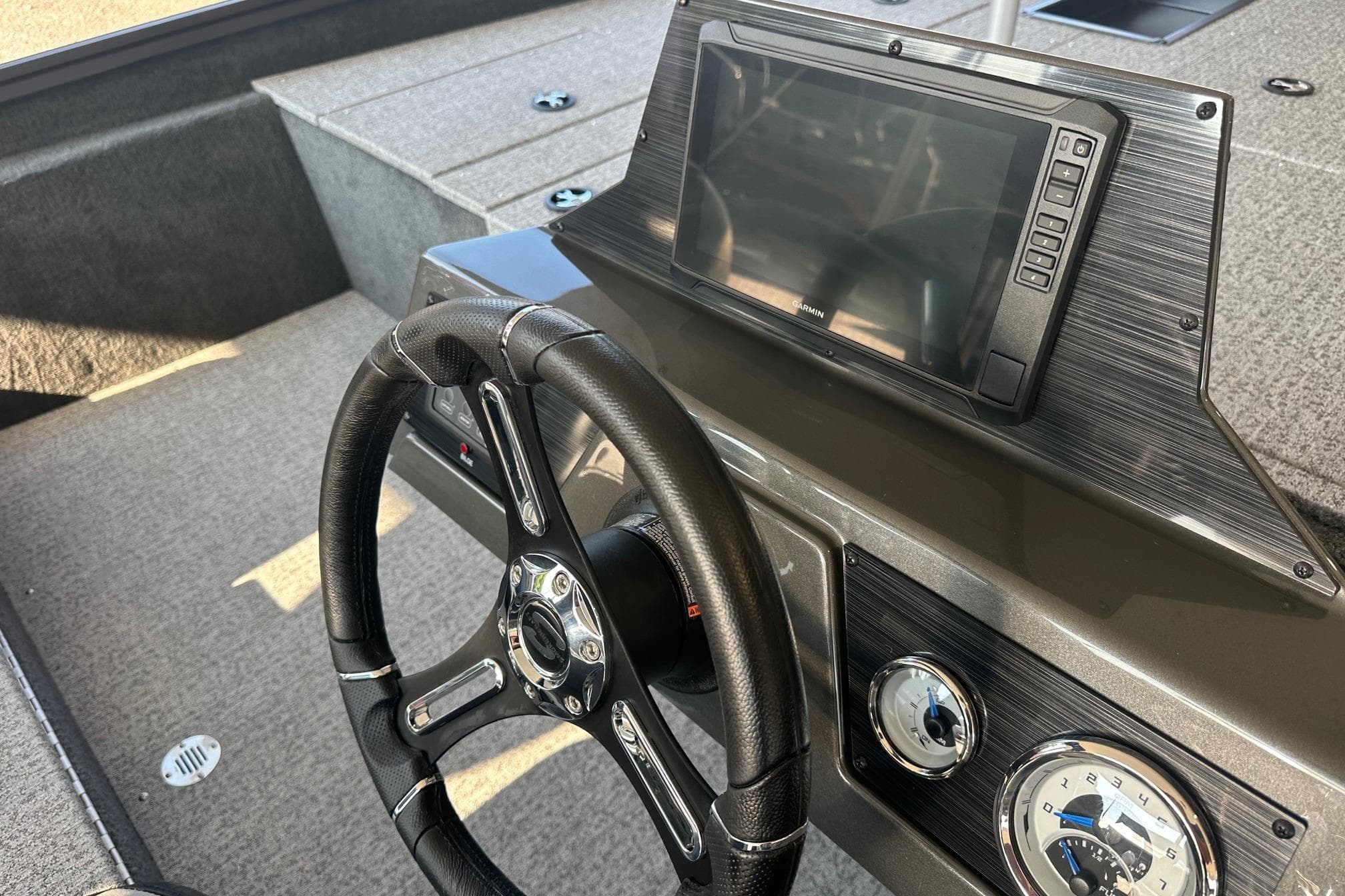 2026 Smoker Craft VIPER 175 boat dashboard with steering wheel and navigation display.