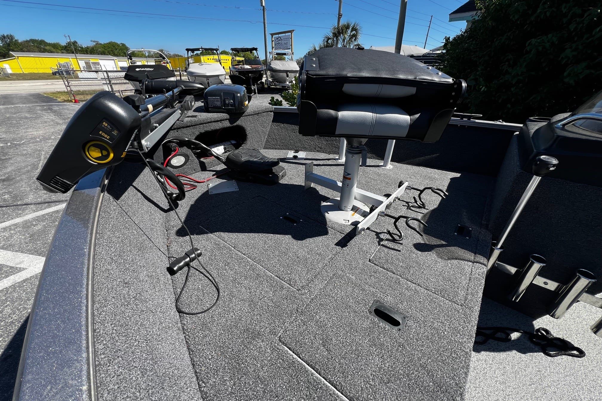 2023 Crestliner 1600 Vision boat interior with seating and equipment, parked outdoors.
