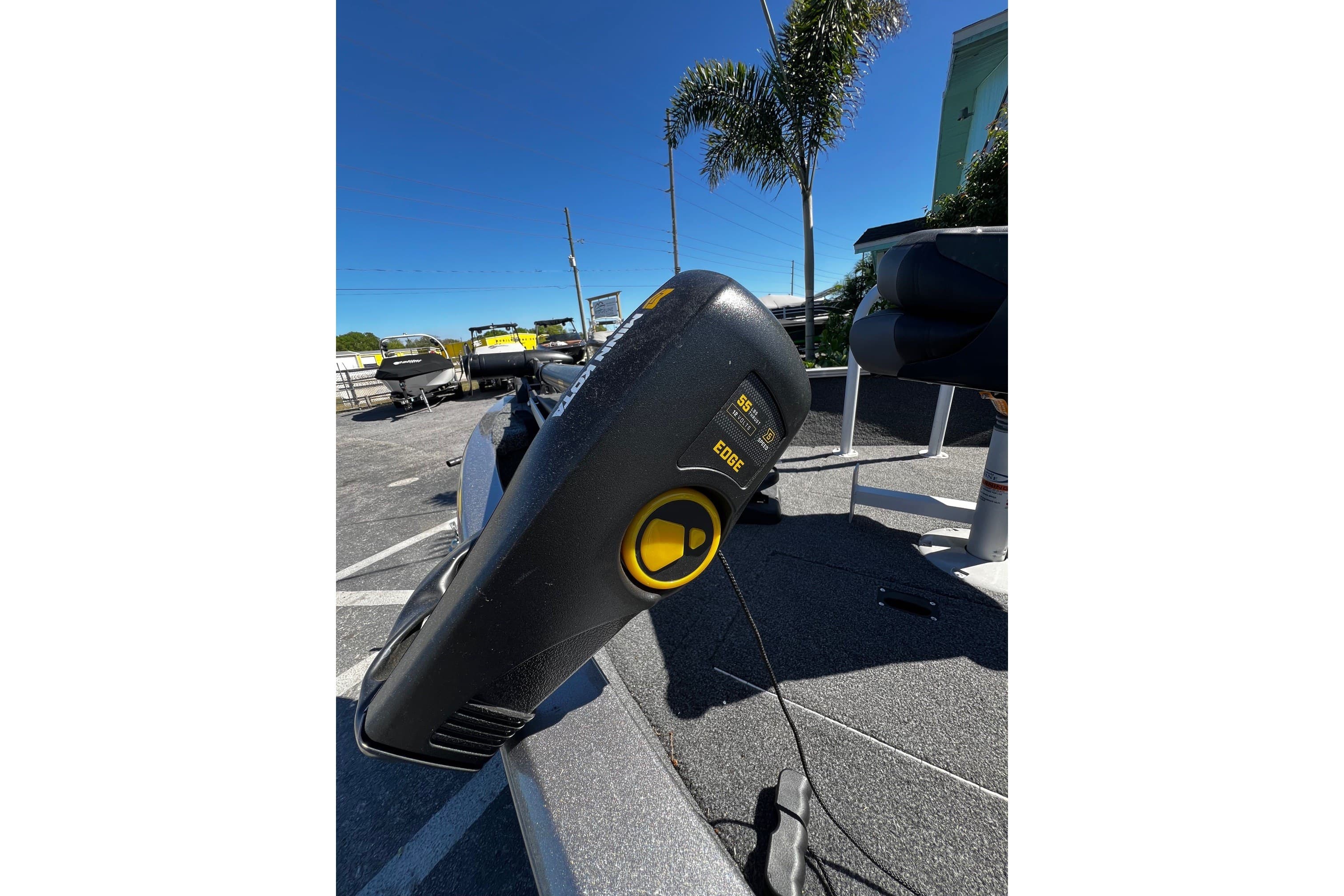 2023 Crestliner 1600 Vision boat with trolling motor in sunny outdoor setting.