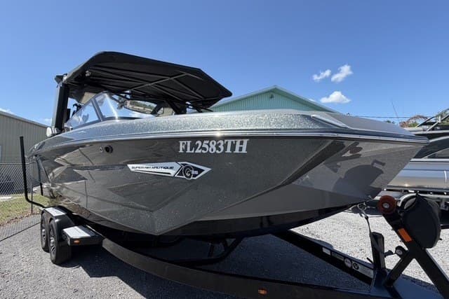 2022 Nautique Super Air Nautique G25 boat on trailer under clear blue sky.