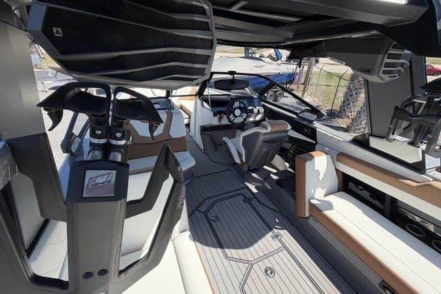 Interior of 2022 Nautique Super Air Nautique G25 boat, featuring modern seating and sleek design.