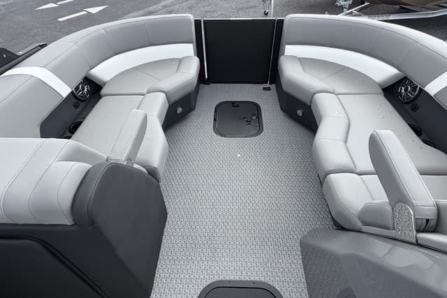 Luxurious seating area of 2027 Evotti 523CS boat with modern design and gray upholstery.
