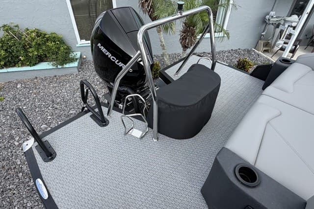 2027 Evotti 523CS boat deck with Mercury engine, featuring sleek design and modern seating.
