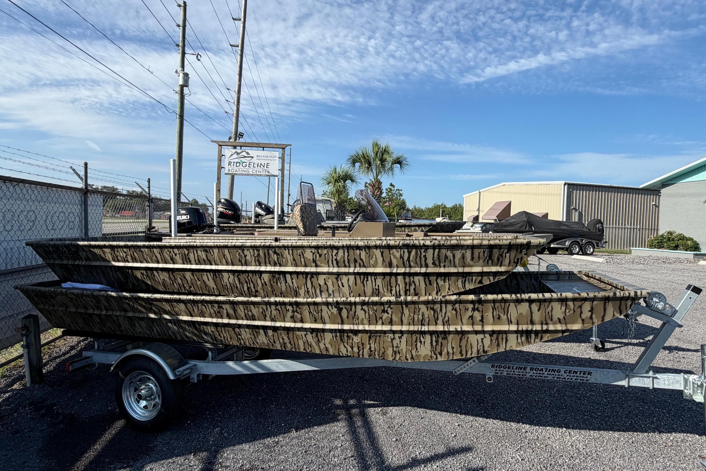 2026 Smoker Craft 1432 Jon boat with camouflage design on a trailer at JBA Boats.