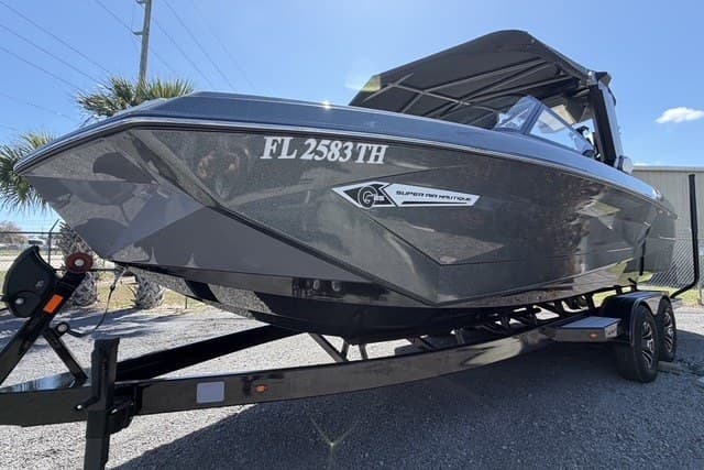 2022 Nautique Super Air Nautique G25 boat on trailer, side view.