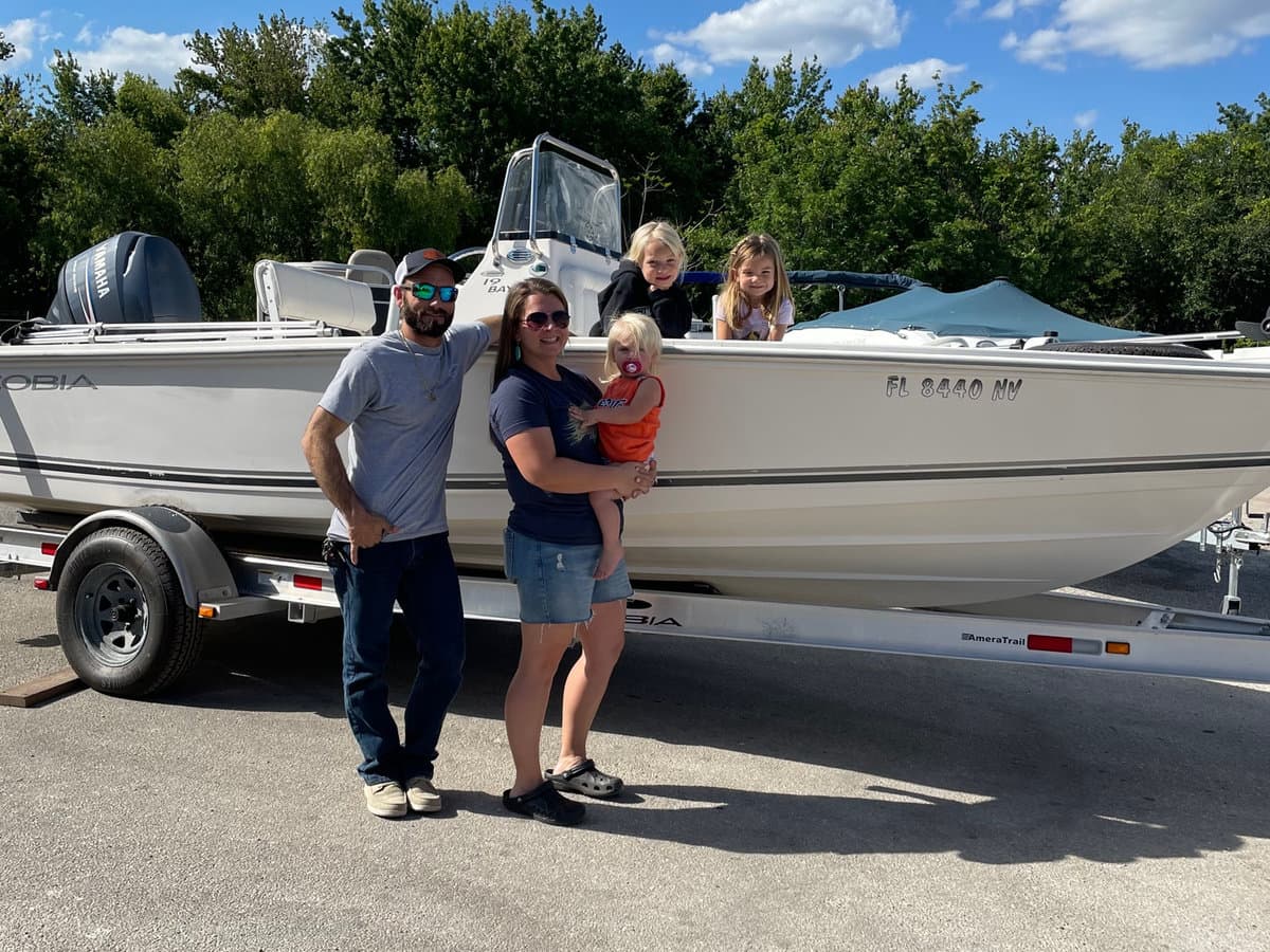 Family with their freshly serviced boat